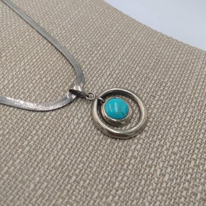 Sterling Silver and Genuine Turquoise Pendant with a Silver Tone Herringbone Chain