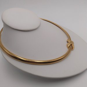 AVON Omega Gold Tone Collar Necklace with Infinity Criss Cross Rhinestone Pendant, 1990's