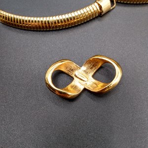 AVON Omega Gold Tone Collar Necklace with Infinity Criss Cross Rhinestone Pendant, 1990's