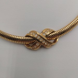 AVON Omega Gold Tone Collar Necklace with Infinity Criss Cross Rhinestone Pendant, 1990's