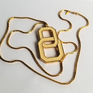 MONET Gold Tone and Light Cream Yellow Enamel Interlocking Links Pendant and Snake Chain