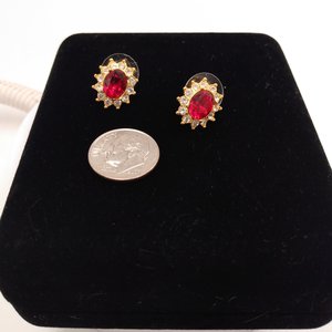Sparkling Vintage Rosa Gold Tone Clear Rhinestones Surrounding a Larger Red Oval Rhinestone Stud Earrings