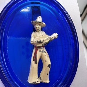 Vintage Cobalt Glass Oval with a Metal Mexican Man Wall Ornament