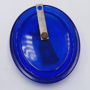 Vintage Cobalt Glass Oval with a Metal Mexican Man Wall Ornament