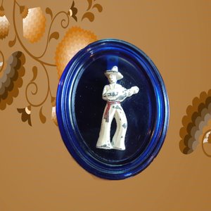 Vintage Cobalt Glass Oval with a Metal Mexican Man Wall Ornament
