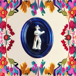 Vintage Cobalt Glass Oval with a Metal Mexican Man Wall Ornament