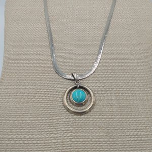 Sterling Silver and Genuine Turquoise Pendant with a Silver Tone Herringbone Chain