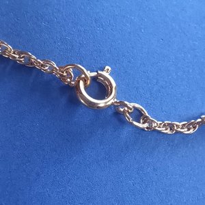 Gold Tone with Rhinestone Center on Gold Tone Rope Chain Pendant Necklace