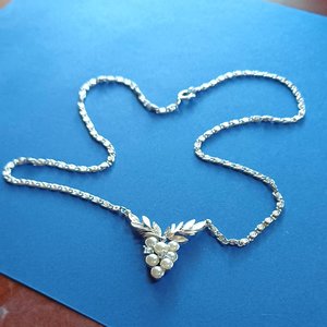 AVON Silver Tone Snail Chain With Faux Pearl and Rhinestones Grapes Center Pendant