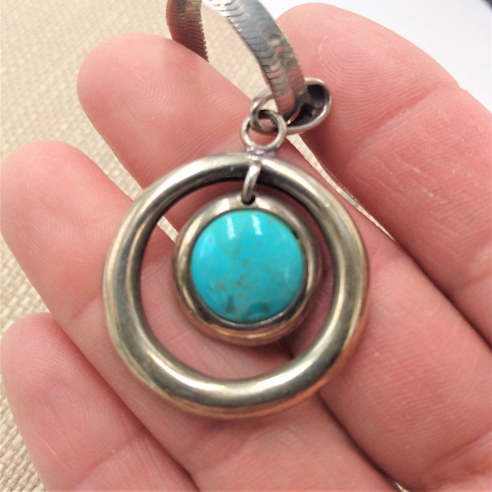 Sterling Silver and Genuine Turquoise Pendant with a Silver Tone Herringbone Chain