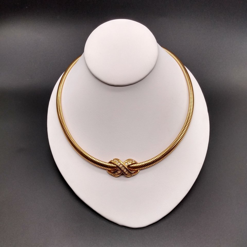 AVON Omega Gold Tone Collar Necklace with Infinity Criss Cross Rhinestone Pendant, 1990's