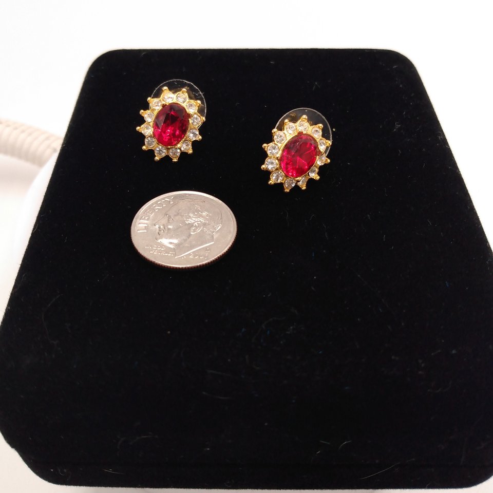 Sparkling Vintage Rosa Gold Tone Clear Rhinestones Surrounding a Larger Red Oval Rhinestone Stud Earrings