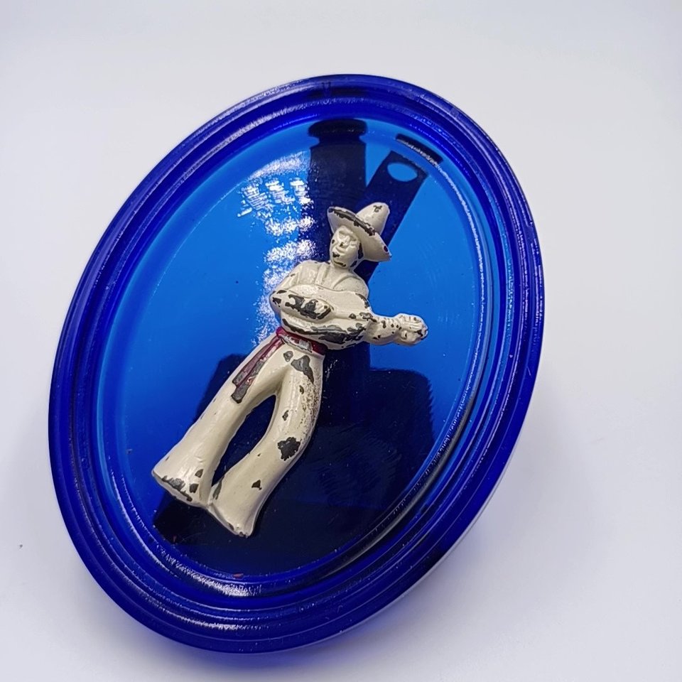 Vintage Cobalt Glass Oval with a Metal Mexican Man Wall Ornament