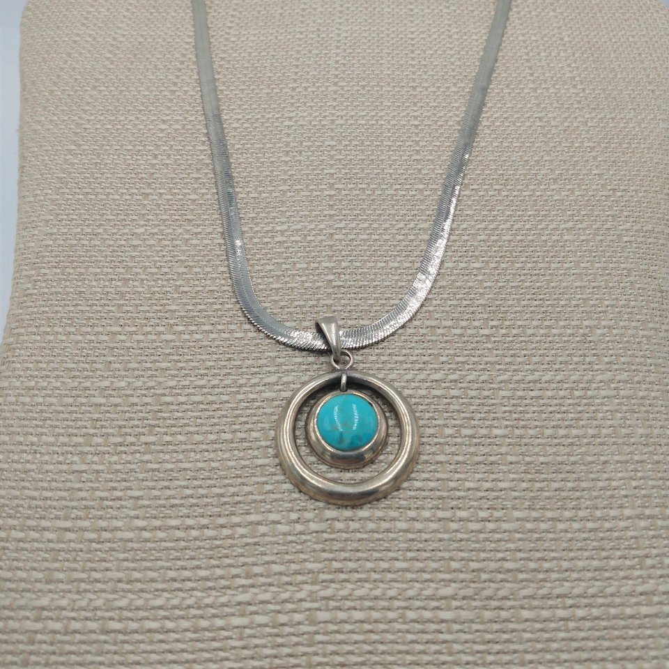 Sterling Silver and Genuine Turquoise Pendant with a Silver Tone Herringbone Chain