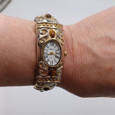 P.O.V. Gold Tone Ladies Clamper Fashion Watch with Tigers Eye, Runs